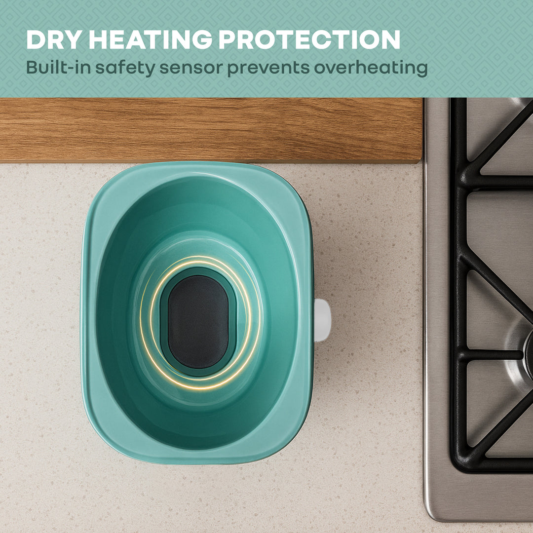 Teal silicone mat with safety sensor on a stove, featuring text about dry heating protection.