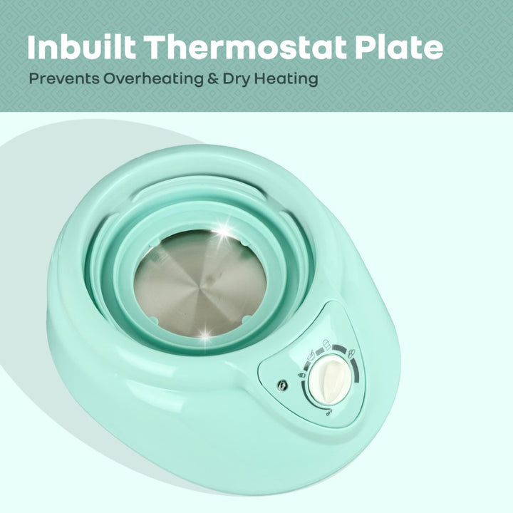 Mint green pet heating pad with an inbuilt thermostat plate on a light blue background.
