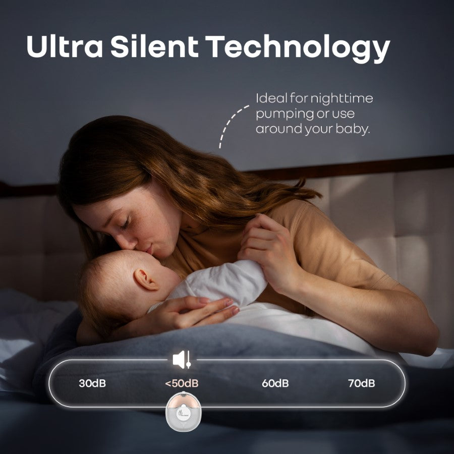 Woman holding a baby in bed with text about ultra silent technology